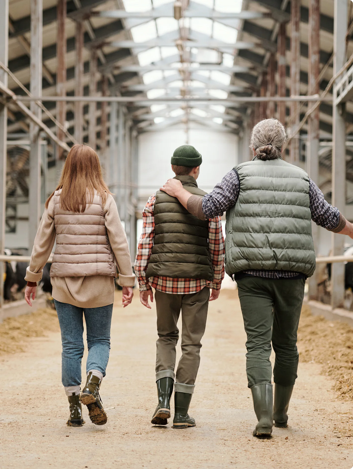 Family walking through a livestock barn